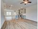 Spacious kitchen and living area features an island, stainless appliances, and wood floors at 3142 Washburn St, Atlanta, GA 30354
