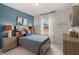 Comfortable bedroom with a neutral color scheme, stylish lamps, and coordinated decor at 324 Navigator Ln, Mcdonough, GA 30253