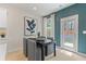 Contemporary dining area featuring a black table, gray chairs, and stylish decor at 324 Navigator Ln, Mcdonough, GA 30253