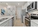 Well-equipped kitchen with stainless steel appliances, white subway tile backsplash, and ample counter space at 324 Navigator Ln, Mcdonough, GA 30253