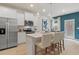 Modern kitchen with stainless steel appliances, white cabinets, and a breakfast bar with seating at 324 Navigator Ln, Mcdonough, GA 30253
