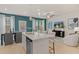 Open-concept kitchen and living area with modern finishes and plenty of natural light at 324 Navigator Ln, Mcdonough, GA 30253
