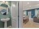 Open-concept living room and kitchen area with modern finishes and stylish decor at 324 Navigator Ln, Mcdonough, GA 30253