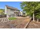 Large backyard featuring a patio, pergola, and a view of the trees at 355 Pintail Ct, Suwanee, GA 30024