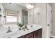 Bathroom featuring double sinks, large mirror and a bath tub with a separate shower at 355 Pintail Ct, Suwanee, GA 30024