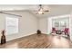 Bright bedroom featuring vaulted ceiling, two windows with blinds and hardwood flooring at 355 Pintail Ct, Suwanee, GA 30024