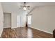 Vaulted bedroom with hardwood flooring, ample natural light from windows and a ceiling fan at 355 Pintail Ct, Suwanee, GA 30024
