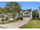 Charming two-story home featuring a well-manicured lawn, attached two car garage, and traditional design at 355 Pintail Ct, Suwanee, GA 30024