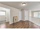 Bright hallway featuring hardwood floors, neutral walls, and a view into a laundry area at 355 Pintail Ct, Suwanee, GA 30024