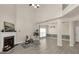 Open living room with fireplace, hardwood floors, and natural light from large windows at 355 Pintail Ct, Suwanee, GA 30024