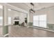 Bright living room boasts fireplace, hardwood floors, and large windows at 355 Pintail Ct, Suwanee, GA 30024