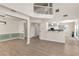 Bright living room featuring an open floor plan, dining area and a view of the kitchen at 355 Pintail Ct, Suwanee, GA 30024