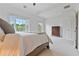 Bright bedroom with a large bed and view of surrounding trees at 1003 Pearl Ne Pt, Sandy Springs, GA 30328