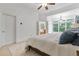 Bright bedroom with white walls and a doorway to the bathroom at 1003 Pearl Ne Pt, Sandy Springs, GA 30328
