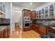 Updated kitchen boasting stainless appliances, custom cabinetry, hardwood floors, and granite countertops at 1003 Pearl Ne Pt, Sandy Springs, GA 30328