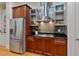 Modern kitchen featuring stainless steel appliances, custom cabinets, and a tiled backsplash at 1003 Pearl Ne Pt, Sandy Springs, GA 30328