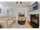 Cozy living room with hardwood floors, fireplace, and comfortable seating arrangement at 1003 Pearl Ne Pt, Sandy Springs, GA 30328