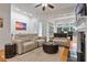 Bright living room showcasing hardwood floors, coffered ceilings, fireplace and modern furnishings at 1003 Pearl Ne Pt, Sandy Springs, GA 30328