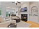 Spacious living room with fireplace, built-ins, hardwood floors, and comfortable seating at 1003 Pearl Ne Pt, Sandy Springs, GA 30328