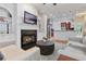Open-concept living room with fireplace, built-ins, and view of the modern kitchen at 1003 Pearl Ne Pt, Sandy Springs, GA 30328