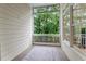 Screened porch showcasing outdoor living space and view of the natural surroundings at 1003 Pearl Ne Pt, Sandy Springs, GA 30328
