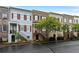 Street view of colorful townhomes, each with unique facades, entry stairs and landscaping at 1003 Pearl Ne Pt, Sandy Springs, GA 30328