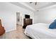 Spacious bedroom with hardwood floors, tray ceiling, and a large dresser at 117 Point View Dr, Canton, GA 30114