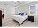 Bright bedroom with wood flooring, a tray ceiling and large windows at 117 Point View Dr, Canton, GA 30114