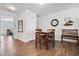 Inviting dining area features wood floors and table with seating for four at 117 Point View Dr, Canton, GA 30114