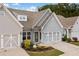 Beautiful front exterior of townhomes with 2-car garage and stone accents enhance the appeal at 117 Point View Dr, Canton, GA 30114