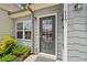 Charming front door with glass window, gray paint, and manicured bushes near the entrance at 117 Point View Dr, Canton, GA 30114