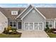 Charming townhome featuring a well-manicured front yard and a two-car garage at 117 Point View Dr, Canton, GA 30114