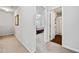 Hallway featuring neutral carpet leading to a bedroom and bathroom at 117 Point View Dr, Canton, GA 30114