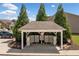 Exterior mailboxes under a gazebo with landscaping near the building's parking area at 117 Point View Dr, Canton, GA 30114