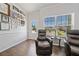 Bright sitting room featuring leather recliners and natural light from a window at 117 Point View Dr, Canton, GA 30114
