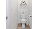 Modern half bath with stylish decor and wood-look flooring at 117 Point View Dr, Canton, GA 30114