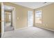 Neutral-toned bedroom featuring multiple windows and neutral trim at 2457 Swan Lake Dr, Grayson, GA 30017