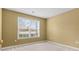 Bedroom with window and neutral carpet at 2457 Swan Lake Dr, Grayson, GA 30017