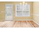 Dining room featuring hardwood floors and a window overlooking the backyard at 2457 Swan Lake Dr, Grayson, GA 30017