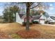 Beautiful two-story house featuring green grass, a two-car garage, and a small tree at 2457 Swan Lake Dr, Grayson, GA 30017