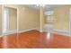 Open-concept living room with hardwood floors seamlessly connects to other areas of the home at 2457 Swan Lake Dr, Grayson, GA 30017