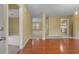 Open-concept living room with hardwood floors seamlessly connects to other areas of the home at 2457 Swan Lake Dr, Grayson, GA 30017