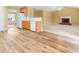Spacious living space featuring a fireplace, kitchen and hardwood floors at 2457 Swan Lake Dr, Grayson, GA 30017