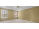 Spacious main bedroom with windows and neutral carpet and trim at 2457 Swan Lake Dr, Grayson, GA 30017