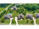 Aerial view of homes in a lovely neighborhood with mature trees and in-ground pools at 468 Scott Farm Dr, Powder Springs, GA 30127