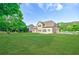 A lush green backyard adjoins the home at 468 Scott Farm Dr, Powder Springs, GA 30127
