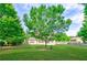 A lovely, large backyard with beautiful, mature trees at 468 Scott Farm Dr, Powder Springs, GA 30127