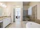 Open bathroom layout features a soaking tub, separate shower and access to main bedroom at 468 Scott Farm Dr, Powder Springs, GA 30127
