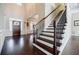 Spacious foyer with hardwood floors and staircase at 468 Scott Farm Dr, Powder Springs, GA 30127