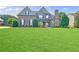 Stunning brick home with a well-manicured lawn and stone accents at 468 Scott Farm Dr, Powder Springs, GA 30127